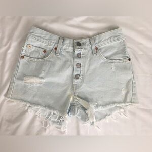 Vintage Levi’s 501 light wash high waisted jean shorts with exposed button fly.